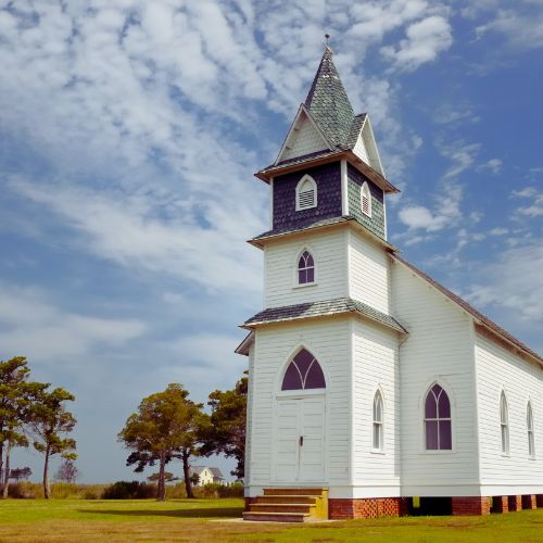 Janitorial team cleaning church pews and worship hall